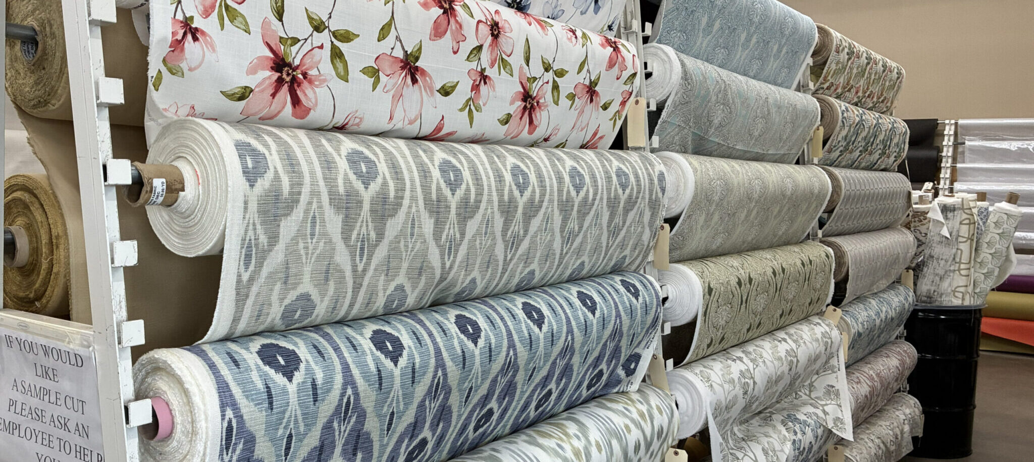 Rolls of decorator prints hanging